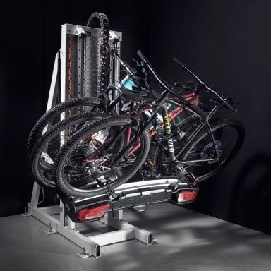 At the Thule Test Center, a Thule towbar bike rack with two bikes mounted to it is tilted as it's being tested.