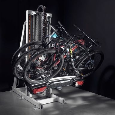 At the Thule Test Center, a Thule towbar bike rack with two bikes mounted to it is tilted as it's being tested.